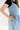 blue inch wide strap jumper with ankle length and form fitting bodice.