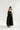 black inch wide strap jumper with ankle length and form fitting bodice.