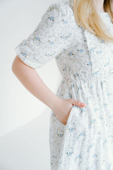 floral dress with puff sleeves and pockets. a line