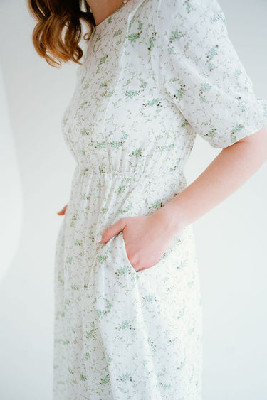 floral dress with puff sleeves and pockets. a line