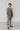 Man wear grey suit with black tie