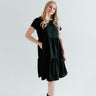 Black modest midi (right below the knee) dress with pockets.