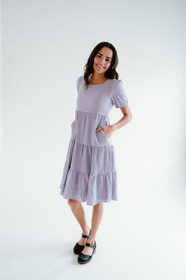textured midi dress with round neck, pockets and puff sleeves