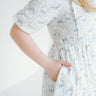 floral dress with puff sleeves and pockets. a line
