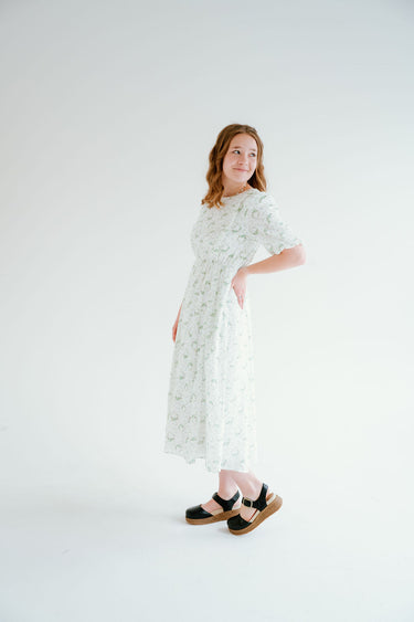 floral dress with puff sleeves and pockets. a line