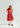 Modest red floral dress with short sleeves and pockets.