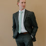 Man wearing charcoal suit